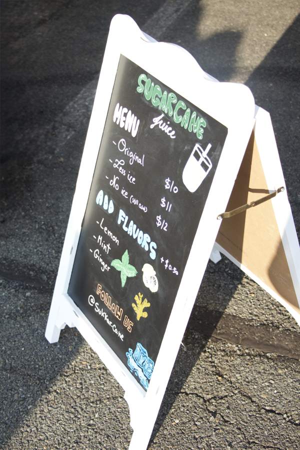 Chalkboard menu sign with prices and flavors