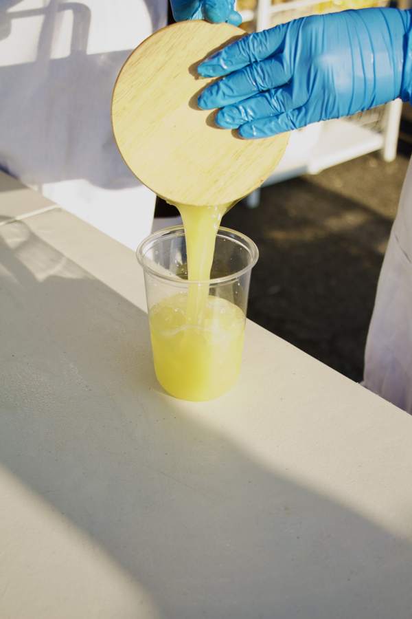 Juice being poured into a clear cup